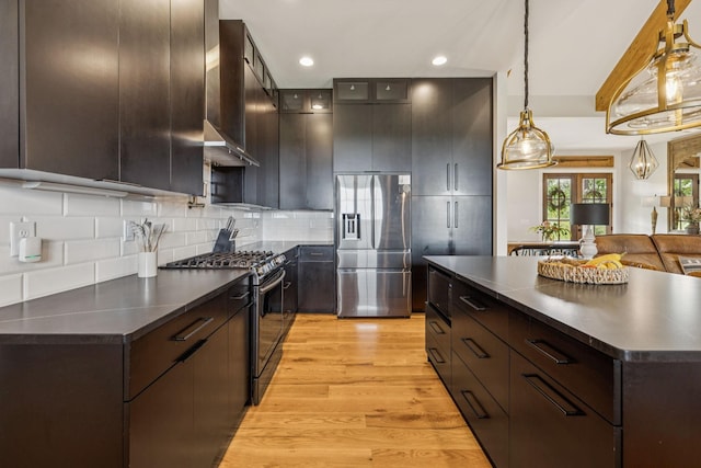 4080 Coles Ferry Pike, Lebanon, TN 37087 - kitchen with appliances with stainless steel finishes, dark countertops, light wood-style flooring, dark brown cabinetry, and recessed lighting