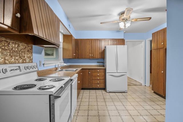3841 Rollingwood Dr, Chattanooga, TN 37406 - kitchen with white appliances, light floors, range hood, ceiling fan, and brown cabinets