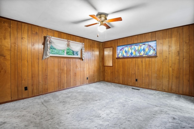 3841 Rollingwood Dr, Chattanooga, TN 37406 - unfurnished room featuring a ceiling fan, carpet flooring, and wood walls