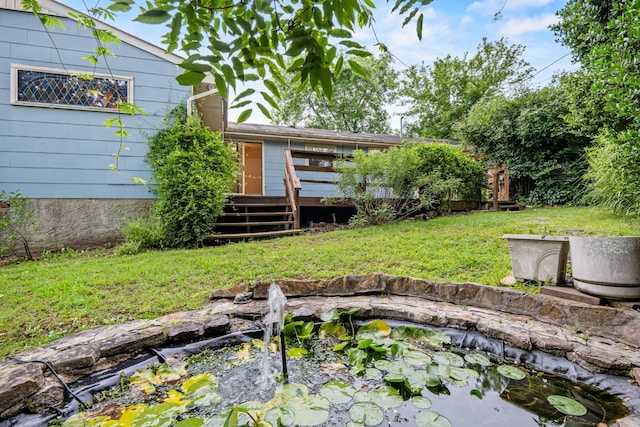 3841 Rollingwood Dr, Chattanooga, TN 37406 - view of green lawn featuring a garden pond and a deck