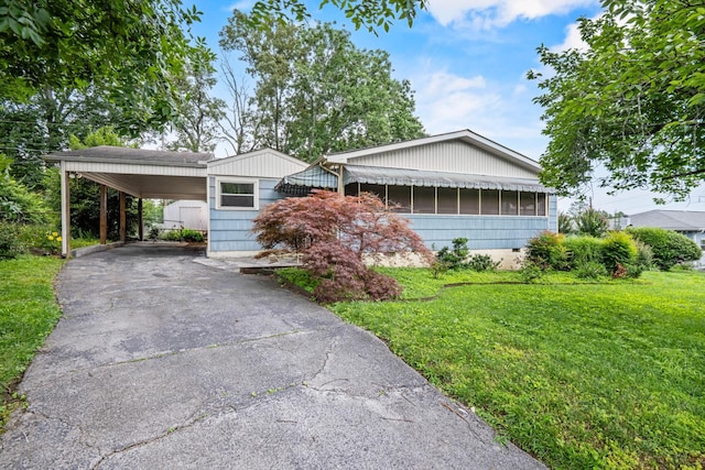 3841 Rollingwood Dr, Chattanooga, TN 37406 - ranch-style house featuring a front yard, driveway, and an attached carport