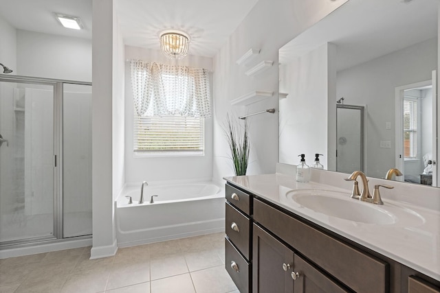 832 Green Meadow Ln, Smyrna, TN 37167 - bathroom featuring vanity, a shower stall, a garden tub, a chandelier, and tile patterned flooring