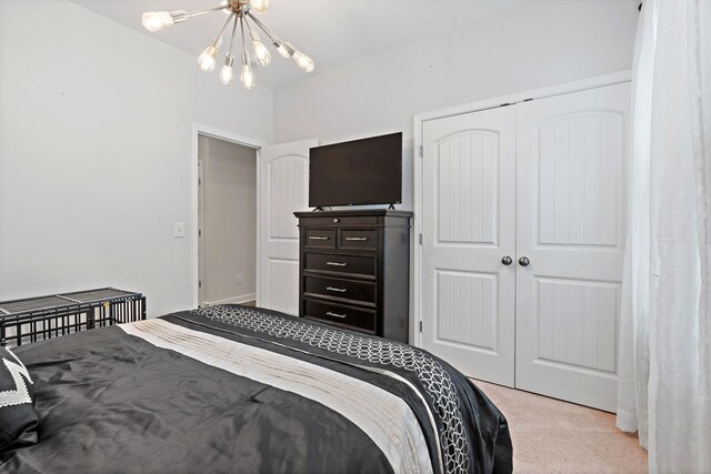 832 Green Meadow Ln, Smyrna, TN 37167 - bedroom with light carpet, a chandelier, and a closet
