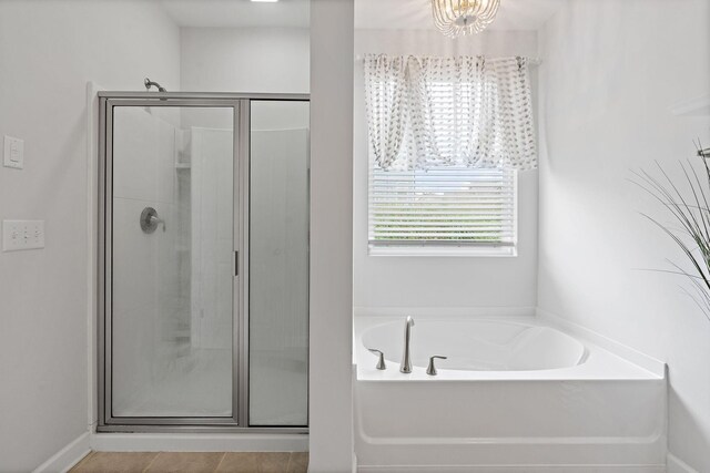 832 Green Meadow Ln, Smyrna, TN 37167 - full bath with a shower stall, a garden tub, and a chandelier