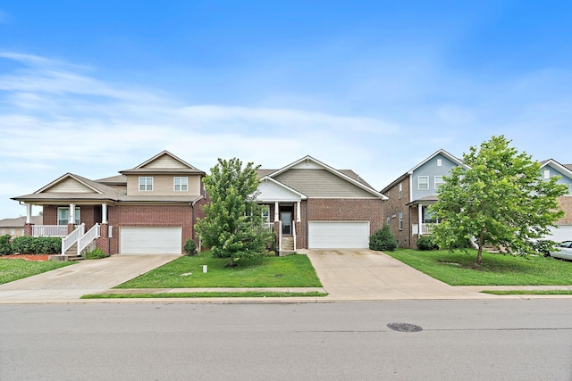 832 Green Meadow Ln, Smyrna, TN 37167 - view of front of home featuring driveway, brick siding, and an attached garage