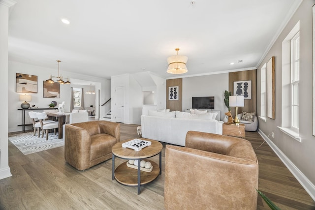 2101 Branford Pl Unit 201, Thompsons Station, TN 37179 - living room featuring wood finished floors, stairway, a chandelier, ornamental molding, and recessed lighting