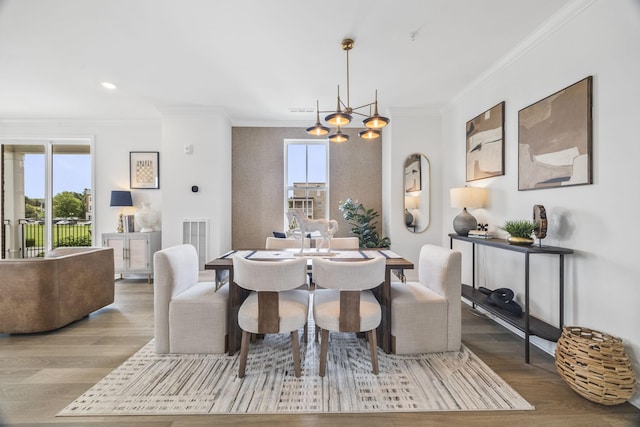 2101 Branford Pl Unit 201, Thompsons Station, TN 37179 - dining room with ornamental molding, healthy amount of natural light, wood finished floors, a chandelier, and recessed lighting