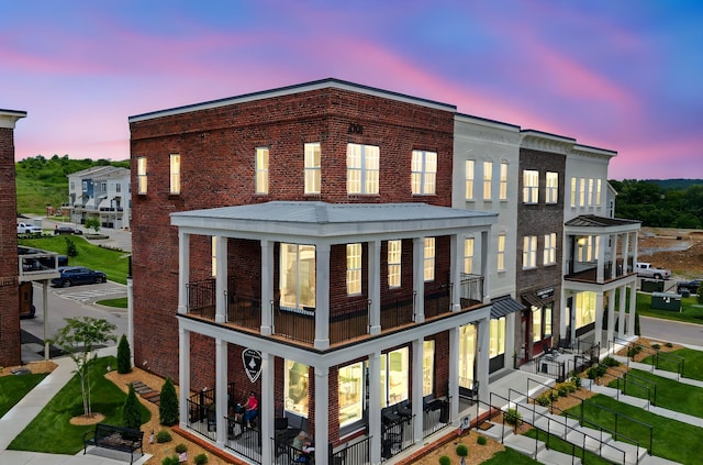 2101 Branford Pl Unit 201, Thompsons Station, TN 37179 - rear view of house with a balcony and brick siding