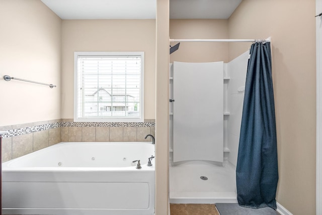 3351 Cotham Ln, Clarksville, TN 37042 - bathroom featuring a shower stall, a jetted tub, and tile patterned flooring
