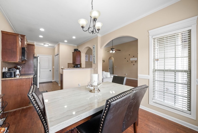 3351 Cotham Ln, Clarksville, TN 37042 - dining area featuring arched walkways, ornamental molding, a ceiling fan, recessed lighting, and a chandelier