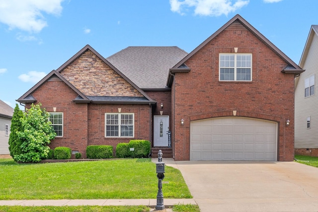 3351 Cotham Ln, Clarksville, TN 37042 - view of front of home with brick siding, a front yard, driveway, and a garage