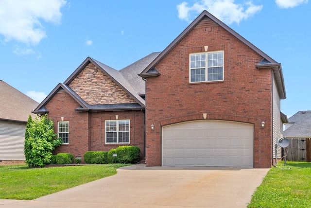 3351 Cotham Ln, Clarksville, TN 37042 - view of front of home with concrete driveway, brick siding, a garage, and a front yard