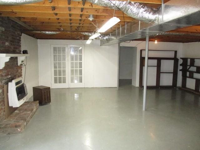 829 Kenny St, Gallatin, TN 37066 - basement with heating unit and a brick fireplace