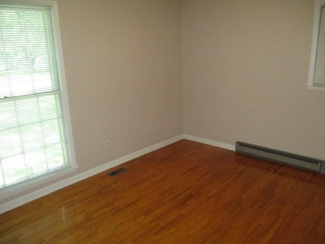 829 Kenny St, Gallatin, TN 37066 - spare room featuring a baseboard radiator, healthy amount of natural light, and wood finished floors