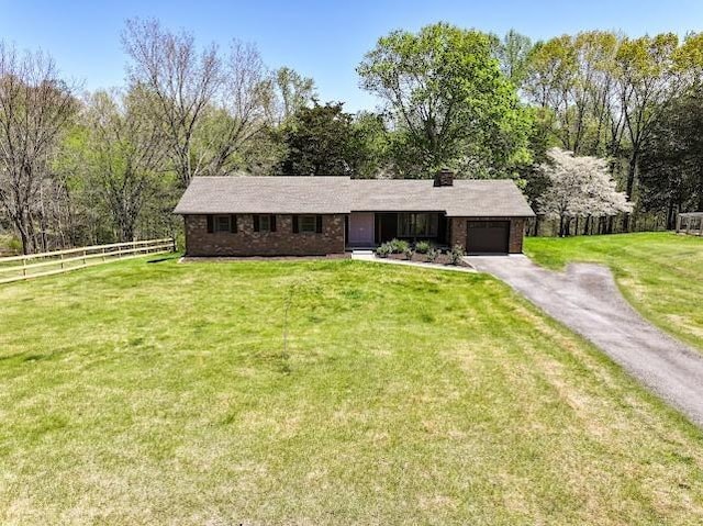 2355 Davidson Graveyard Rd, Clarksville, TN 37043 - ranch-style home featuring an attached garage, asphalt driveway, and brick siding