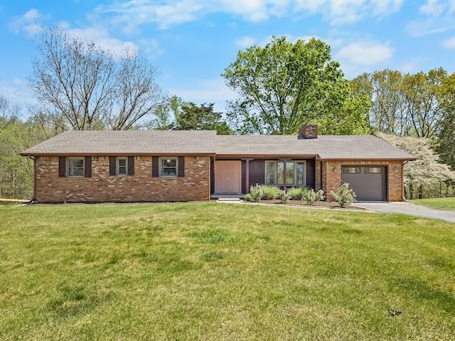 2355 Davidson Graveyard Rd, Clarksville, TN 37043 - ranch-style home with a garage, driveway, brick siding, and a front lawn