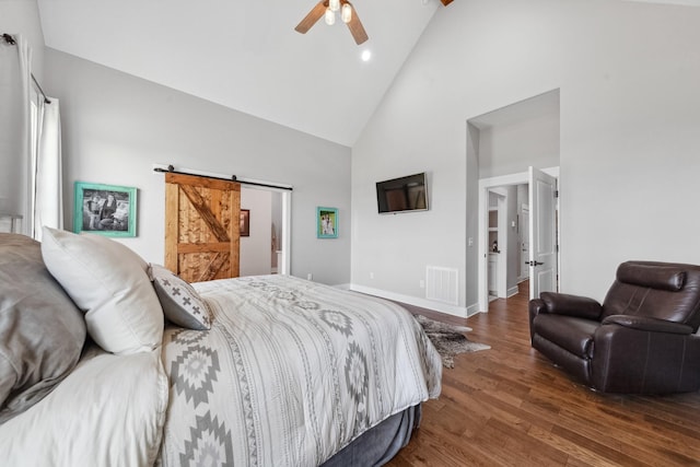 5247 Flat Creek Rd, Spring Hill, TN 37174 - bedroom featuring a barn door, high vaulted ceiling, wood finished floors, recessed lighting, and a ceiling fan