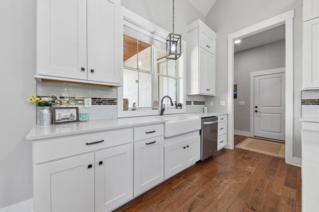 5247 Flat Creek Rd, Spring Hill, TN 37174 - kitchen featuring dishwasher, dark wood-style floors, backsplash, white cabinetry, and light countertops