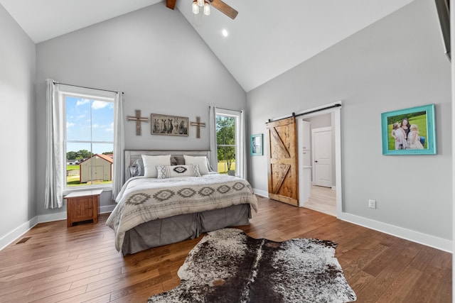 5247 Flat Creek Rd, Spring Hill, TN 37174 - bedroom with high vaulted ceiling, a barn door, wood finished floors, a ceiling fan, and recessed lighting
