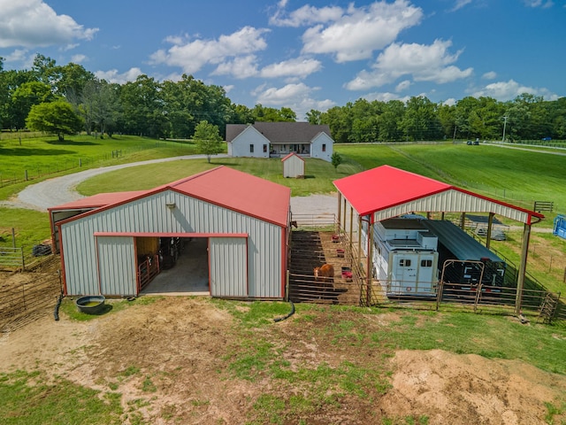 5247 Flat Creek Rd, Spring Hill, TN 37174 - view of pole building with dirt driveway, view of wooded area, and an exterior structure