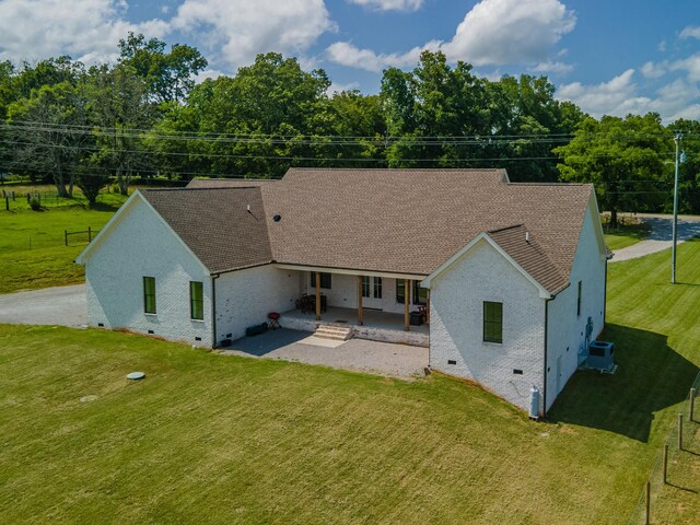 5247 Flat Creek Rd, Spring Hill, TN 37174 - back of property with crawl space, a patio, brick siding, and roof with shingles