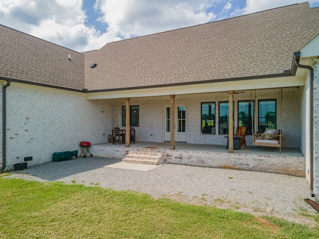 5247 Flat Creek Rd, Spring Hill, TN 37174 - rear view of house featuring brick siding, roof with shingles, a patio area, and a ceiling fan