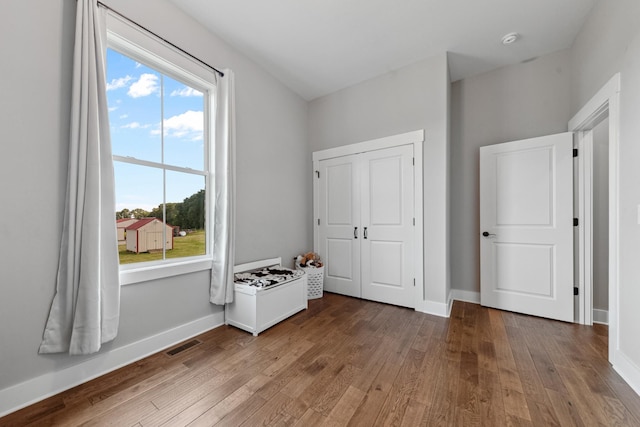 5247 Flat Creek Rd, Spring Hill, TN 37174 - unfurnished bedroom with wood-type flooring and multiple windows