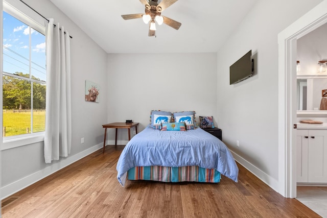 5247 Flat Creek Rd, Spring Hill, TN 37174 - bedroom featuring light wood-style floors, ensuite bath, and a ceiling fan