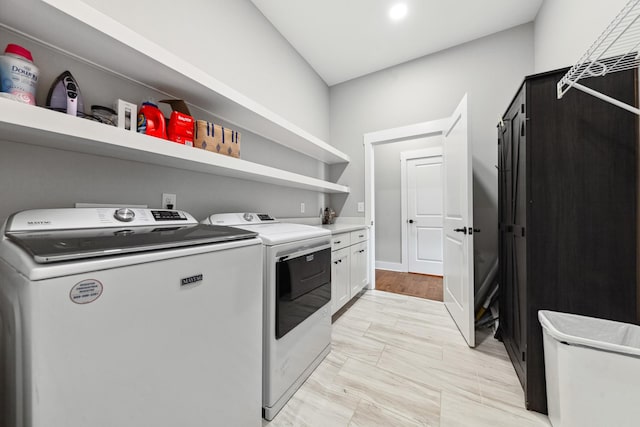 5247 Flat Creek Rd, Spring Hill, TN 37174 - laundry area featuring washer and dryer and cabinet space