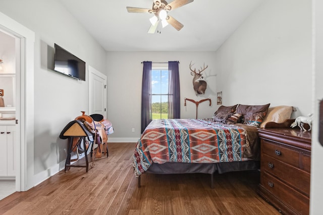 5247 Flat Creek Rd, Spring Hill, TN 37174 - bedroom featuring wood finished floors, a ceiling fan, and connected bathroom