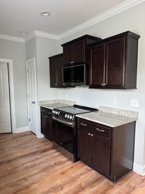 2747 Candlewick Ct, Murfreesboro, TN 37127 - kitchen featuring appliances with stainless steel finishes, light wood-type flooring, crown molding, dark brown cabinets, and light stone countertops