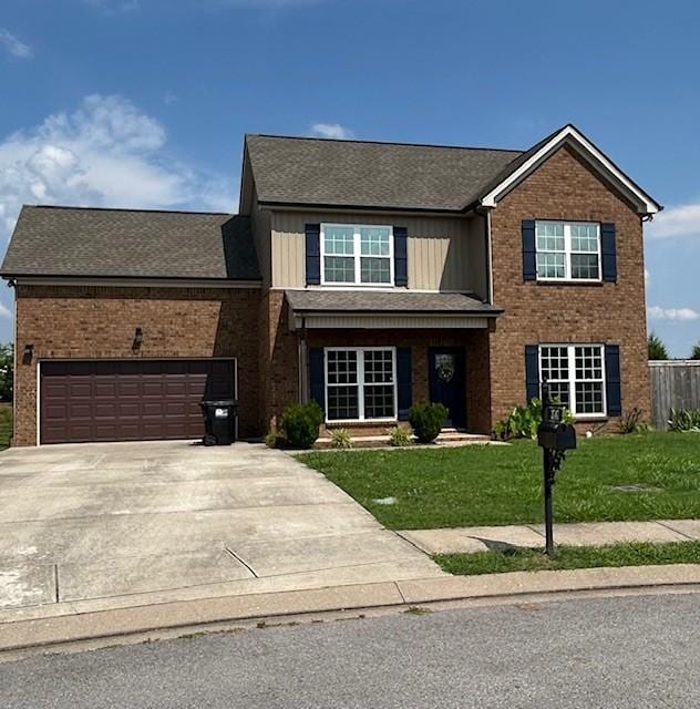 2747 Candlewick Ct, Murfreesboro, TN 37127 - traditional-style house featuring brick siding, a front yard, driveway, and a garage