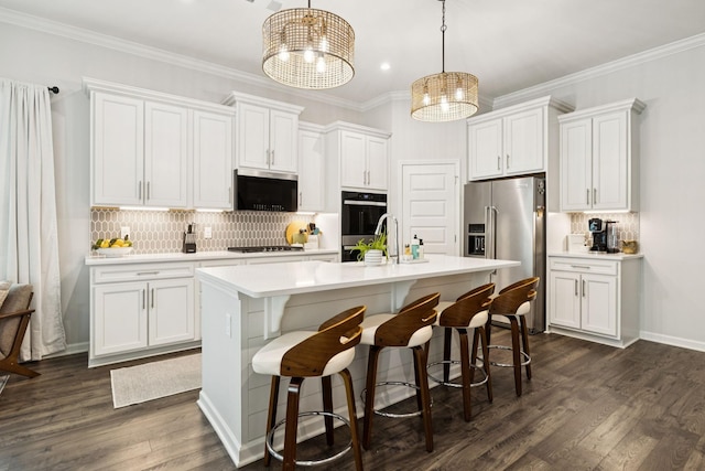 1434 Autumn Leaf Ln, Mount Juliet, TN 37122 - kitchen featuring appliances with stainless steel finishes, white cabinetry, light countertops, a center island with sink, and backsplash