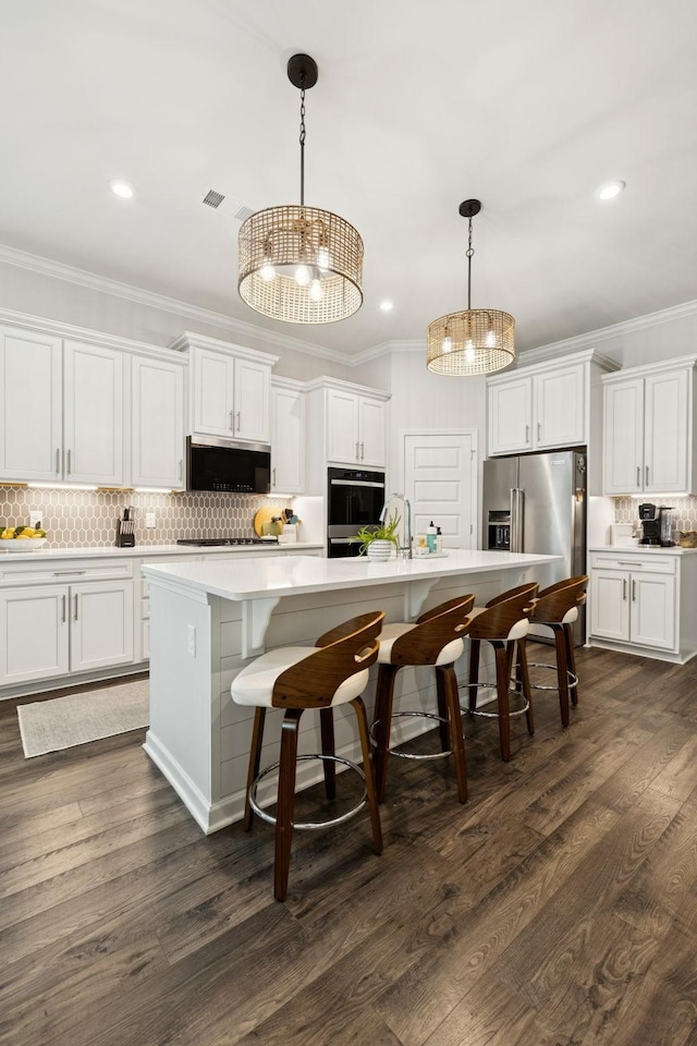 1434 Autumn Leaf Ln, Mount Juliet, TN 37122 - kitchen featuring stainless steel appliances, decorative backsplash, crown molding, white cabinets, and a chandelier