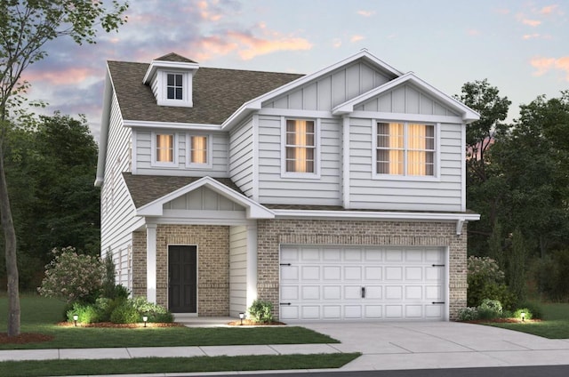 533 Canal Cir, Nashville, TN 37214 - view of front of home with brick siding, roof with shingles, a garage, and concrete driveway