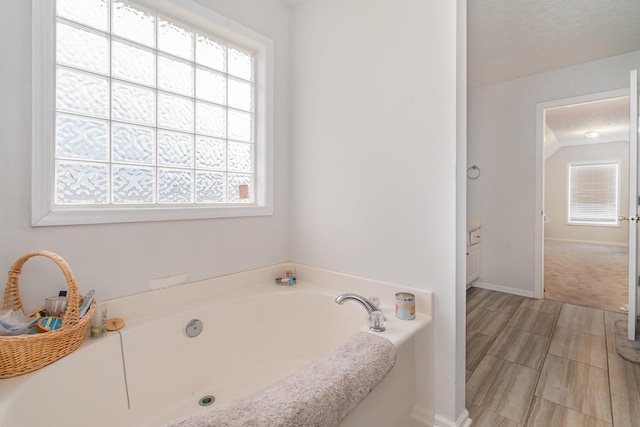 982 Chesire Way, Gallatin, TN 37066 - bathroom featuring healthy amount of natural light and a bath