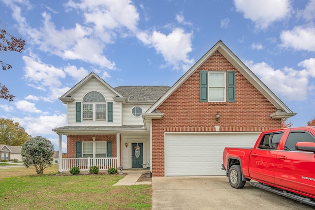 982 Chesire Way, Gallatin, TN 37066 - traditional-style home with covered porch, brick siding, a front lawn, and driveway