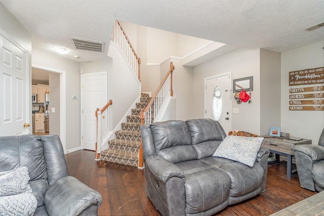 982 Chesire Way, Gallatin, TN 37066 - living area featuring stairs, wood-type flooring, and a textured ceiling
