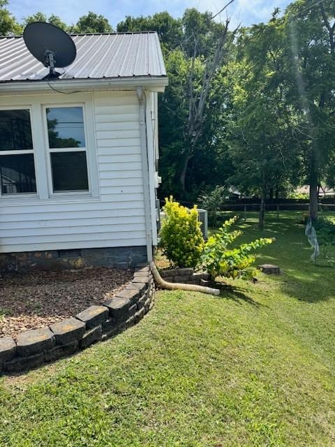 715 N High St N, Winchester, TN 37398 - view of property exterior with a lawn, a metal roof, and crawl space