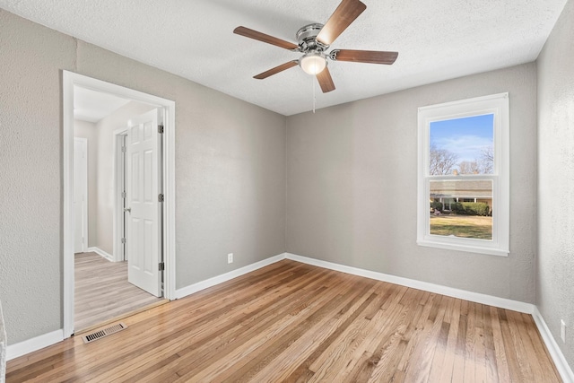 715 N High St N, Winchester, TN 37398 - unfurnished room featuring light wood-type flooring, ceiling fan, and a textured ceiling