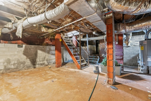 715 N High St N, Winchester, TN 37398 - unfinished basement with water heater, stairs, and concrete block wall