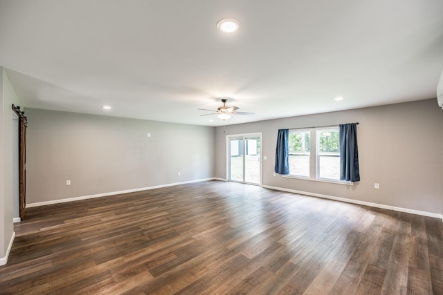 13989 Owens Chapel Rd, Springfield, TN 37172 - spare room featuring a ceiling fan, recessed lighting, dark wood-type flooring, and a barn door