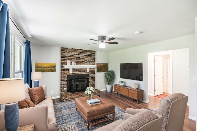 13989 Owens Chapel Rd, Springfield, TN 37172 - living area featuring wood finished floors, ceiling fan, and a wood stove