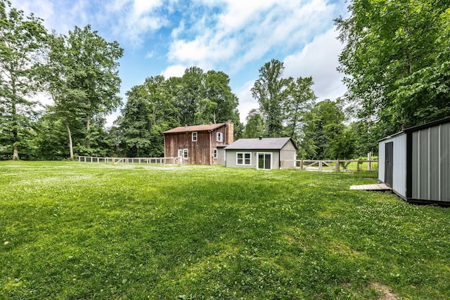 13989 Owens Chapel Rd, Springfield, TN 37172 - fenced backyard featuring an outbuilding and view of wooded area