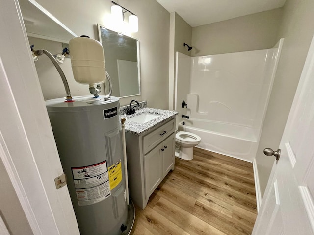 1280 E Gaines St, Lawrenceburg, TN 38464 - full bathroom featuring water heater, vanity, shower / washtub combination, and wood finished floors