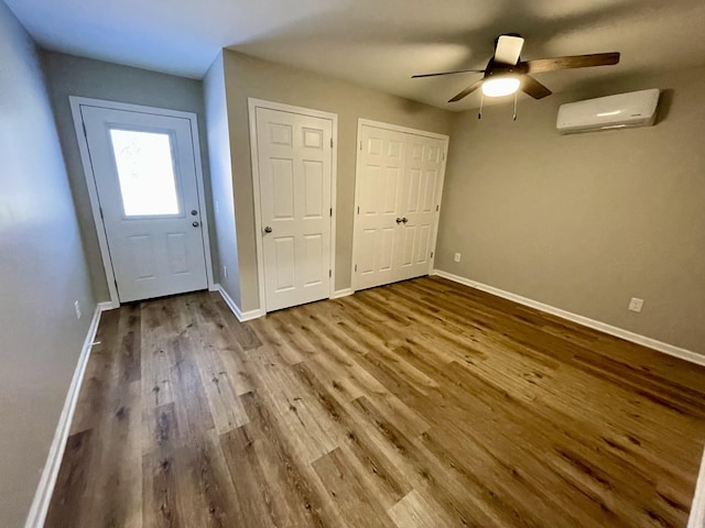 1280 E Gaines St, Lawrenceburg, TN 38464 - foyer with an AC wall unit, wood finished floors, and a ceiling fan
