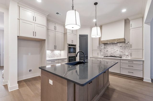 5743 Sagebrush Dr, Murfreesboro, TN 37129 - kitchen with recessed lighting, light wood-style flooring, backsplash, custom range hood, and stainless steel double oven