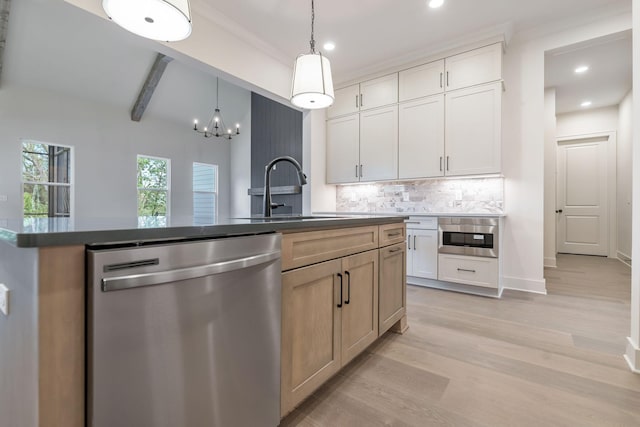 5743 Sagebrush Dr, Murfreesboro, TN 37129 - kitchen featuring dishwasher, decorative backsplash, light wood-style flooring, decorative light fixtures, and recessed lighting