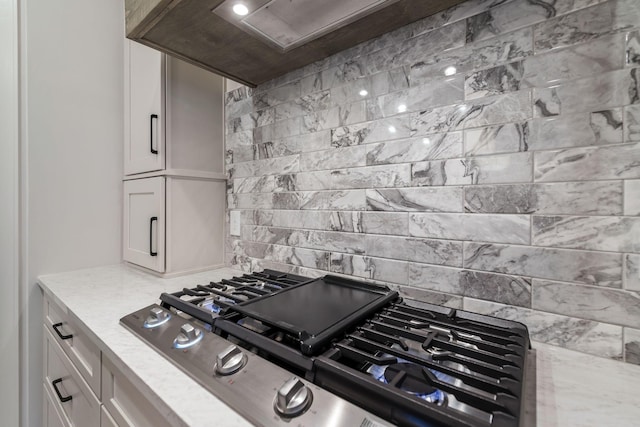 5743 Sagebrush Dr, Murfreesboro, TN 37129 - kitchen with tasteful backsplash, light stone countertops, and white cabinets