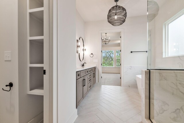 5743 Sagebrush Dr, Murfreesboro, TN 37129 - full bathroom featuring vanity, a freestanding bath, a chandelier, and an enclosed shower
